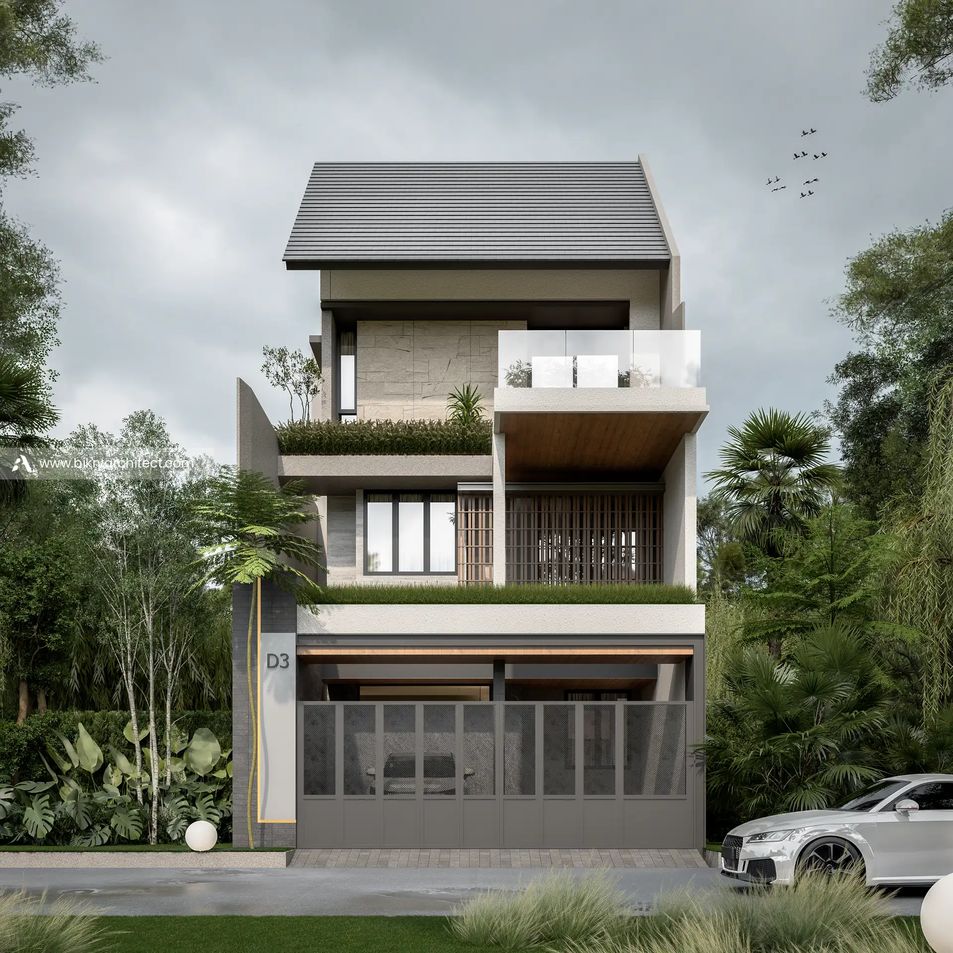 Tampak depan D House dengan pagar besi abu tertutup, planter hijau, dan balkon kaca