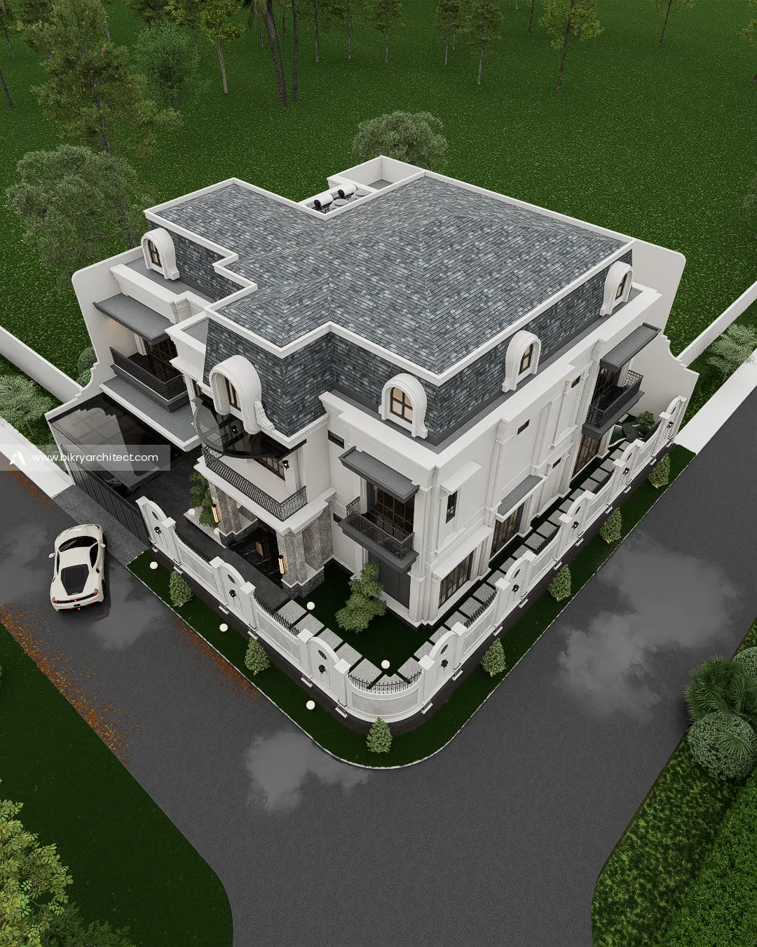 Tampak atas A House Cianjur memperlihatkan atap mansard berbentuk L, carport, dan taman di sudut lahan