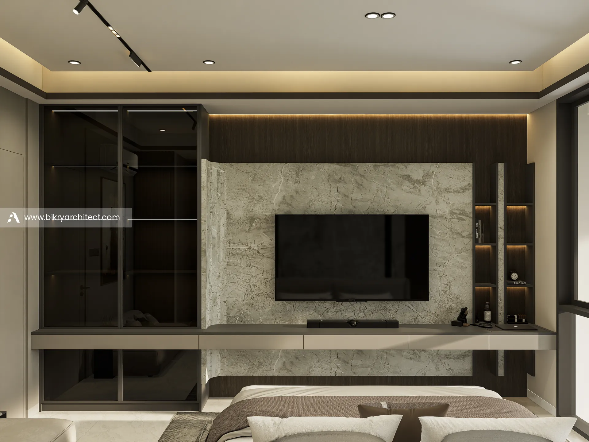Dinding TV kamar tidur utama dengan backdrop marmer, lemari kaca gelap, dan rak berlampu