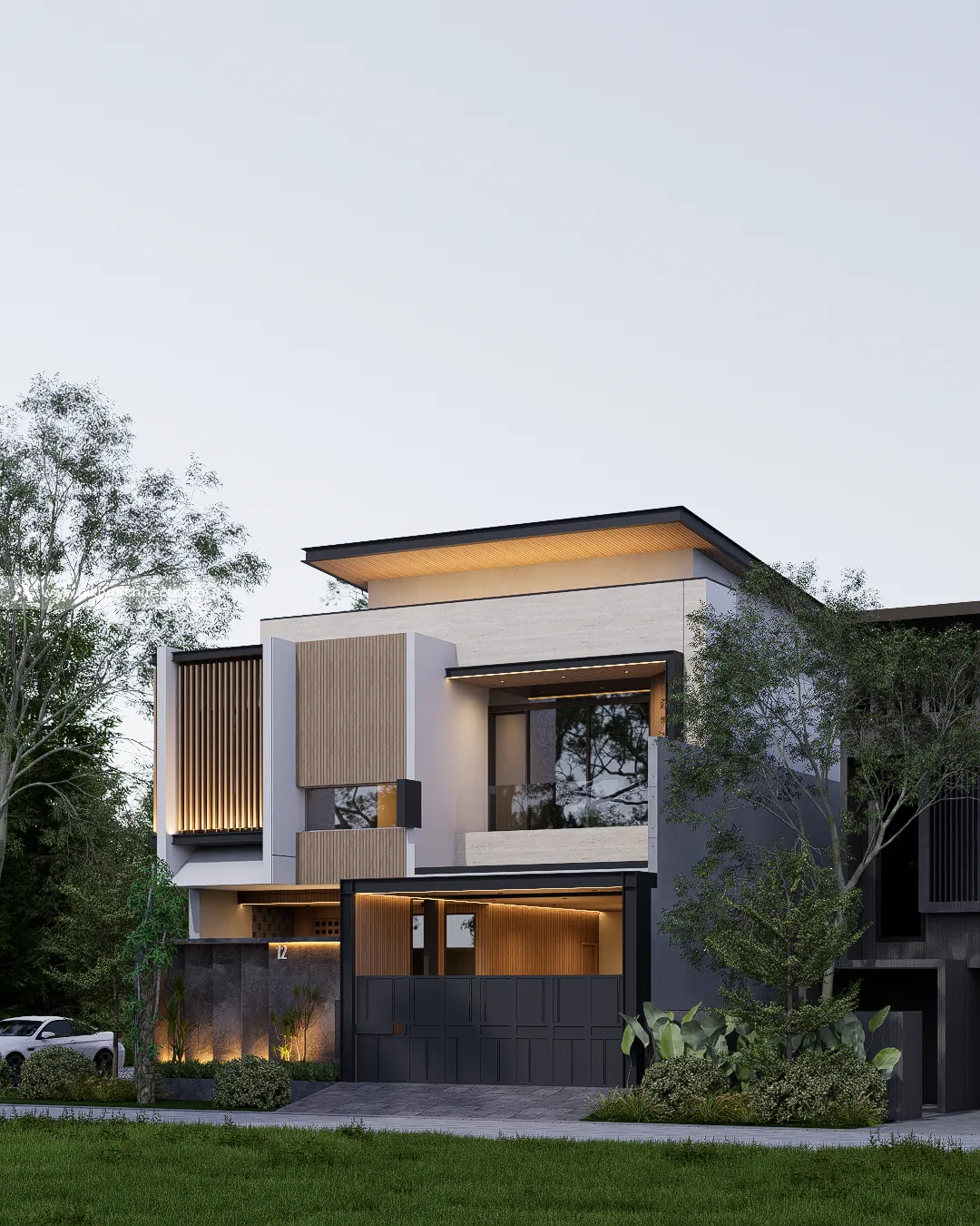 Tampak depan G House dengan carport, pagar gelap, dan taman di depan rumah