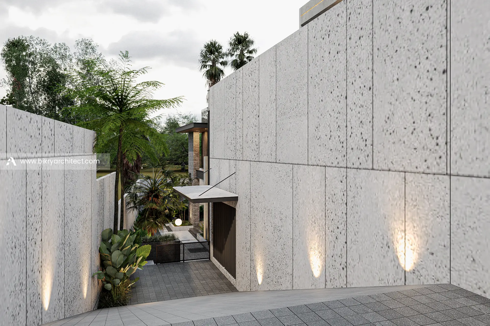 Dinding panel batu bertekstur dengan lampu sorot di sepanjang jalur masuk rumah