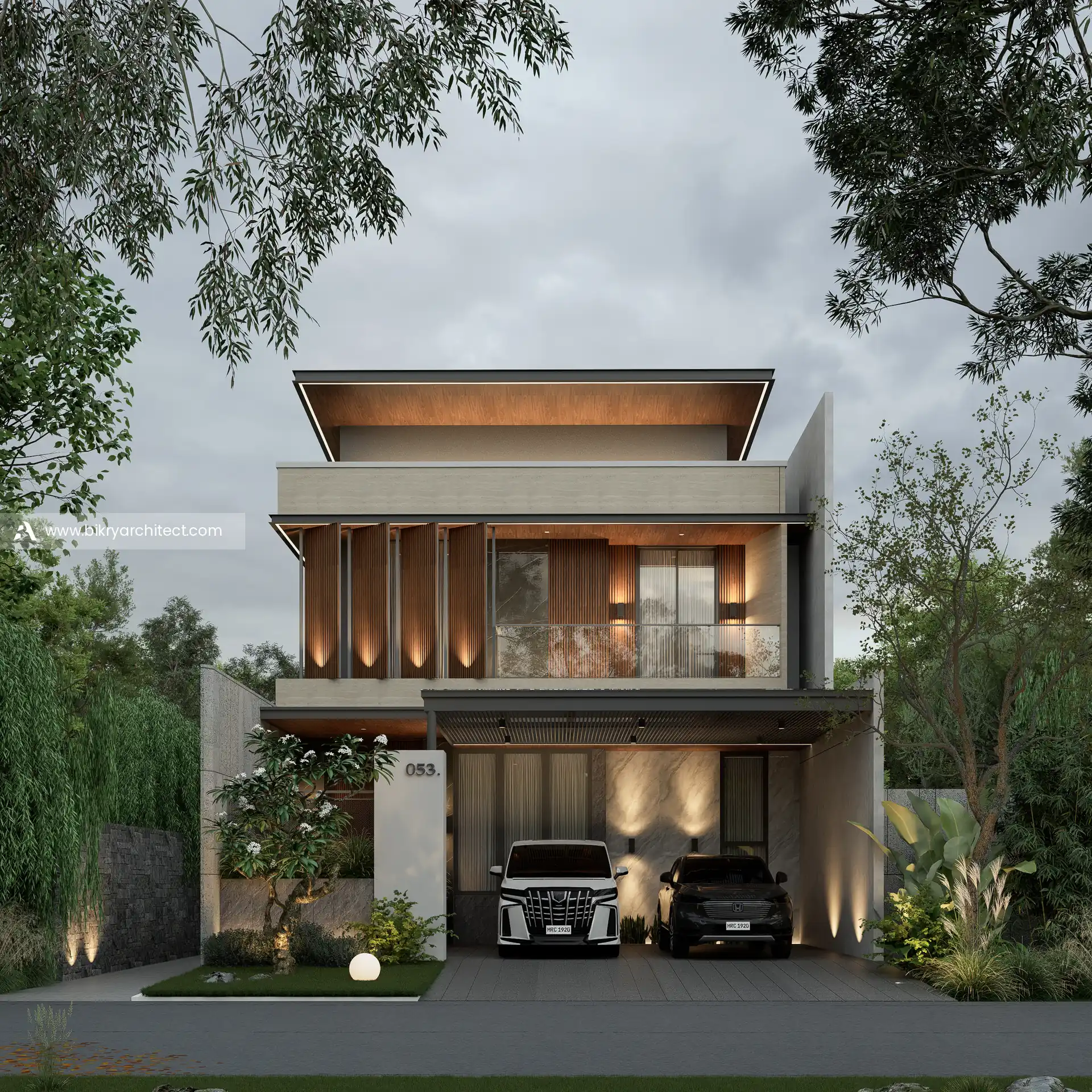 Tampak depan rumah modern tropis 2 lantai di malam hari dengan lampu sorot di sirip kayu