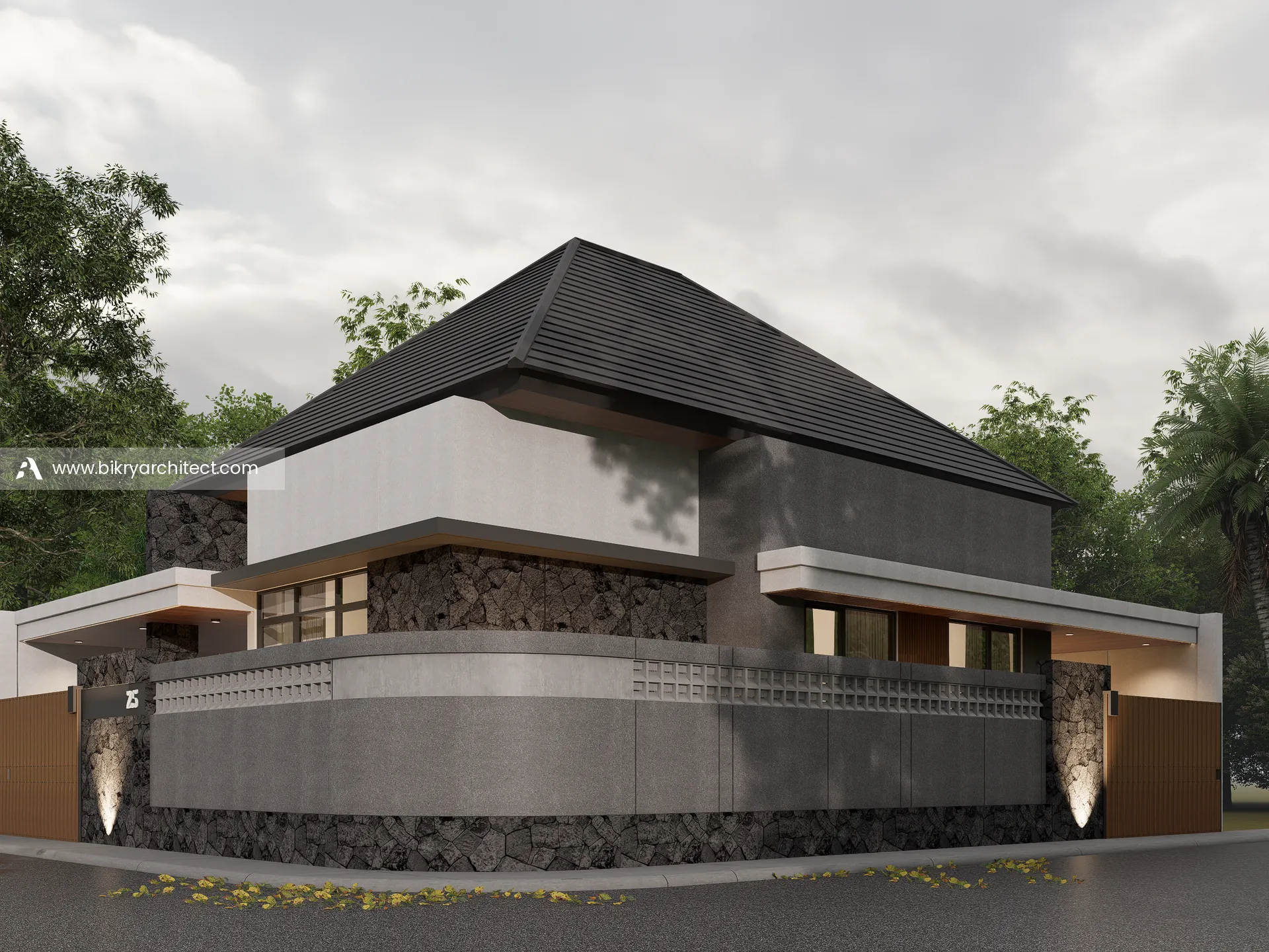 Perspektif sudut lain rumah modern tropis di lahan hook dengan dinding batu alam dan lampu sorot