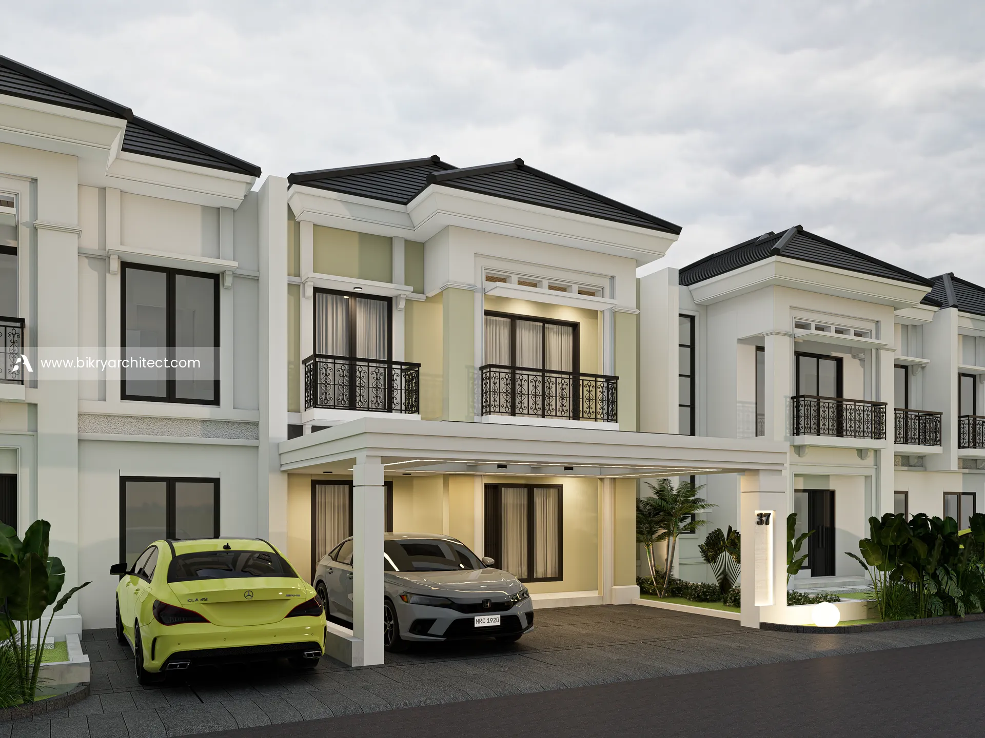 Tampak depan rumah klasik modern 2 lantai dengan carport berkanopi dan balkon di lantai dua