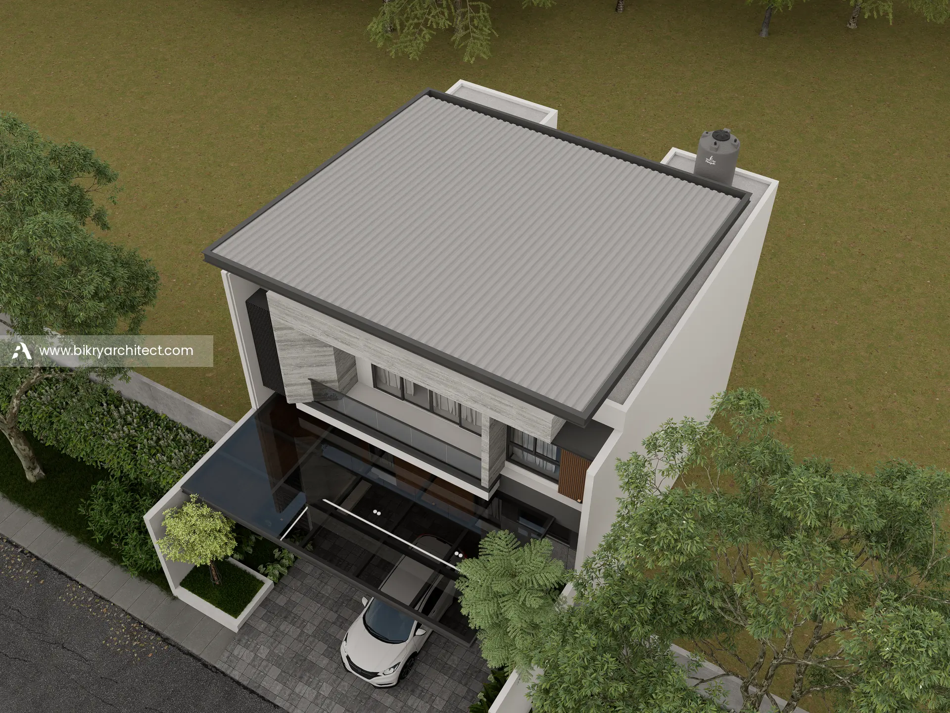 Tampak atas V House Jambi dengan atap, carport, dan taman depan